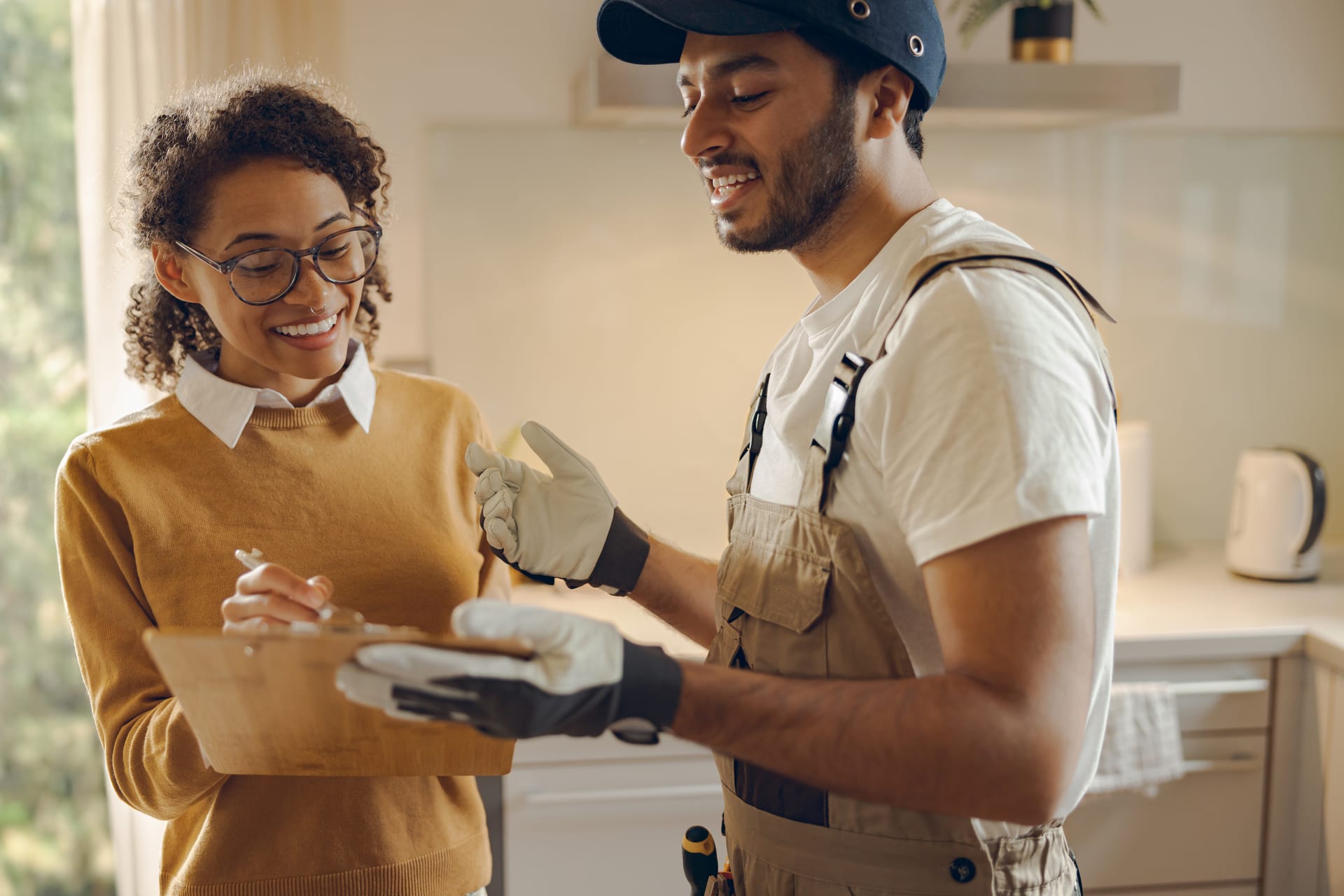 Best Florida Roofing specialist reviewing insurance claim paperwork with a Florida homeowner