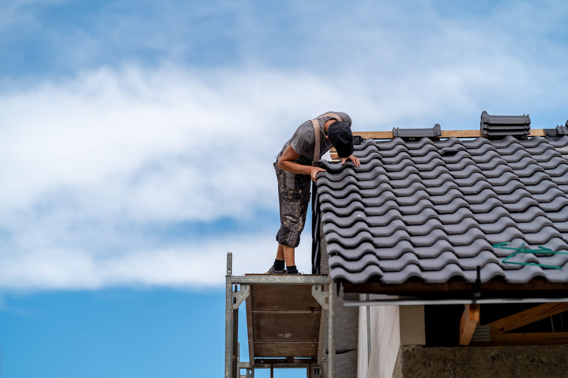 Best Florida Roofing roofer installing a new tile roof in Florida